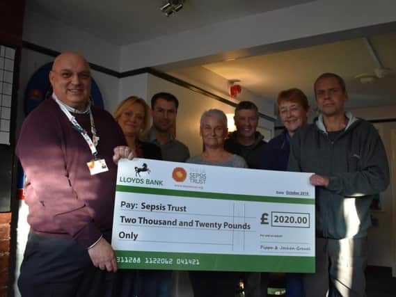 Paul Comhill of the Sepsis Trust, owner of the Half Moon Mark Sutton, pub manager Nicky Unford, Nickie Brightwell (who helped with the fundraising), Nick Summonds, Pippa and Jochen Greuel.