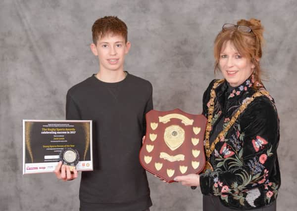 Sailing champion Jack Lewis, the 2017 Young Sports Person of the Year receiving his award from mayor Cllr Belinda Garcia