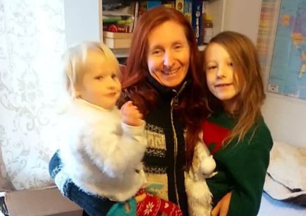 Anna Susnik, 40, with her children Madelie, 2, and Kyan, 7
