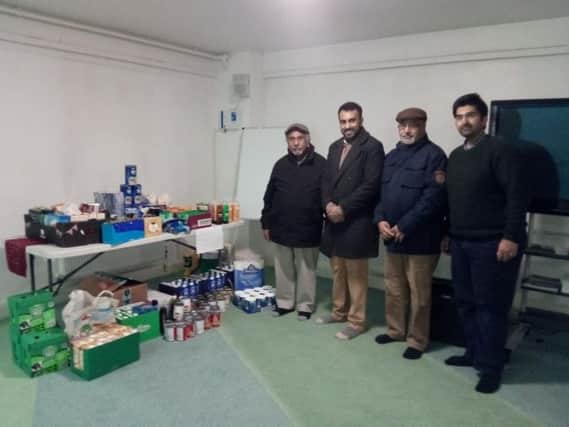 Pictured with the donations are Ahmadiyya Muslim association president Mohammad Salim, youth leader  Irfan Hanif, Monhammed Hanif aND dR iMRAN hANIF