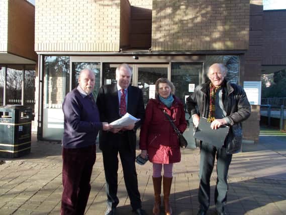 The petition being presented by Restore Kenilworth Lido campaigners to Chris Elliott, CEO of Warwick District Council. From left: Clive Peacock, Chris Elliott, Hansje te Velde and George Jones.