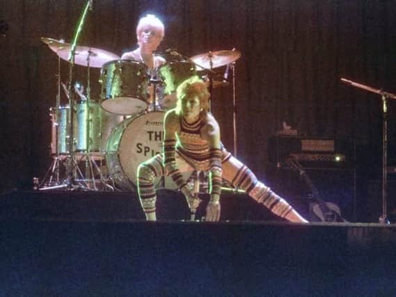 Mick 'Woody' Woodmansey on stage with Bowie.