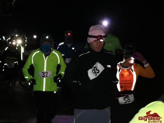 Athletes competing in the Gato Sports Head Torch 10K along the Great Central Way on Wednesday evening