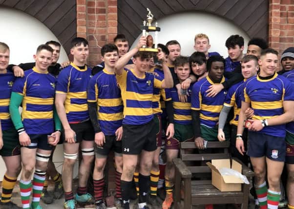 Rugby & District Colts celebrate with the trophy at Sunday's cup final