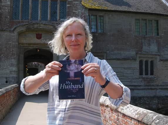Anne Elliott with her new book