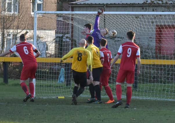 Rocester keeper Carl Allen is unable to prevent Scott Turner opening the scoring for Racing Club. Pictures: Louise Smith