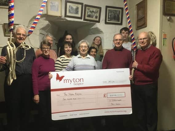 The st nicholas church bell ringers with the cheque. photo submitted.