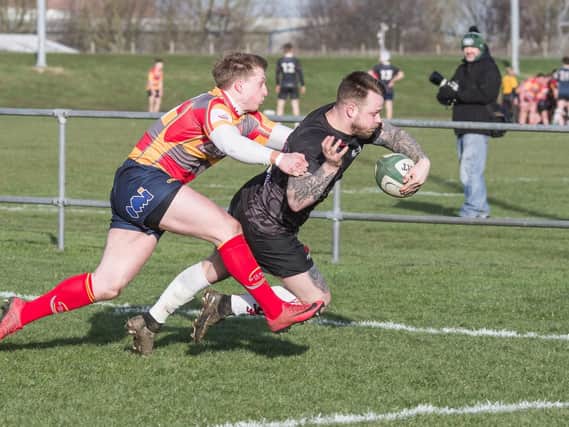 Mike Howes dives over for a try