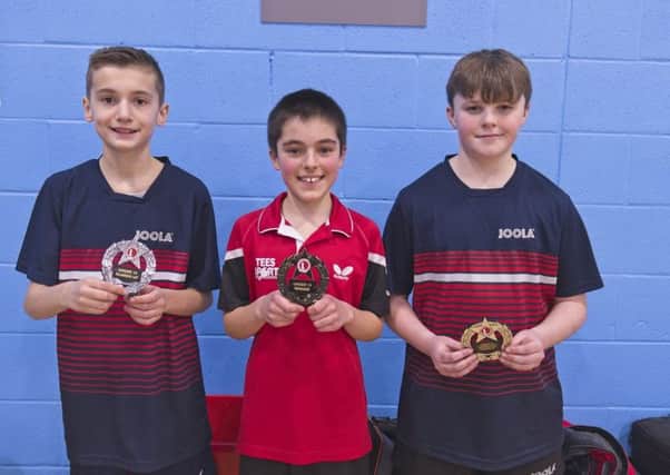 Under-13 gold winner Daniel Stone, centre.