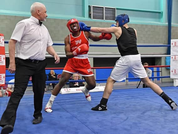 Rugby's Ben Gidley (in the black vest) on his way to a semi-final victory over Tino Bellot from the Dale Youth boxing club in London