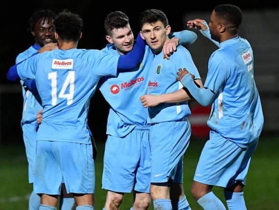 Scorers Charlie Evans and Daniel Summerfield congratulated by their team mates