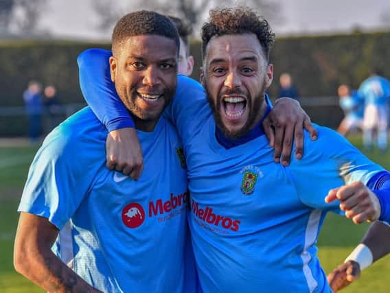 Scorer Simeon Tulloch and Justin Marsden celebrate the second goal against Deeping Rangers  PICTURES BY MARTIN PULLEY