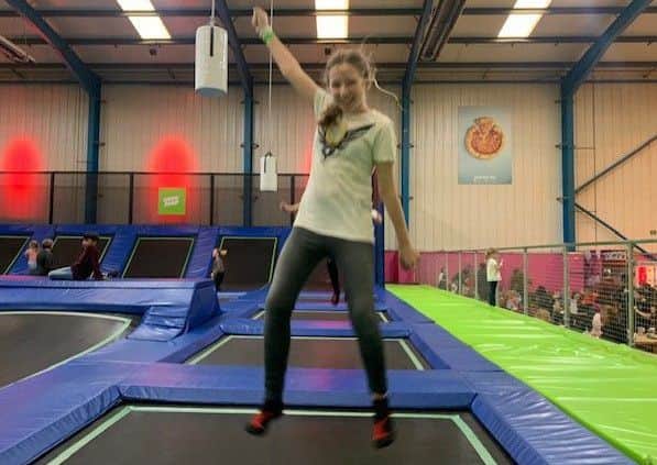 Jasmine Green jumps for joy.