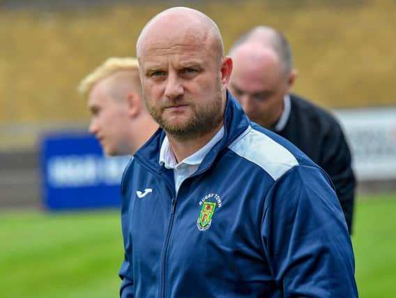 Rugby Town manager Carl Adams praised his side's performance in their top-of-the-table win at Deeping Rangers last week, which lifts them back into second place