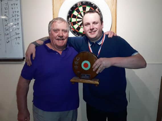 Ryan Tapp won the Friday Night Charity Darts Leagues Tony Grimmett Trophy for the second year running and was presented with his trophy by Bill Grimmett