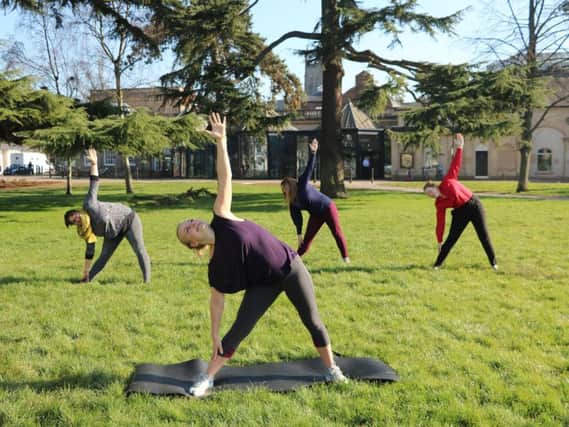 Yoga in the Pump Room Gardens.