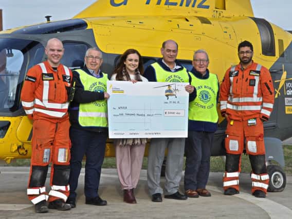 Rugby Rokeby Lions Club present the 5,000 cheque to Warwickshire and Northamptonshire Air Ambulance.