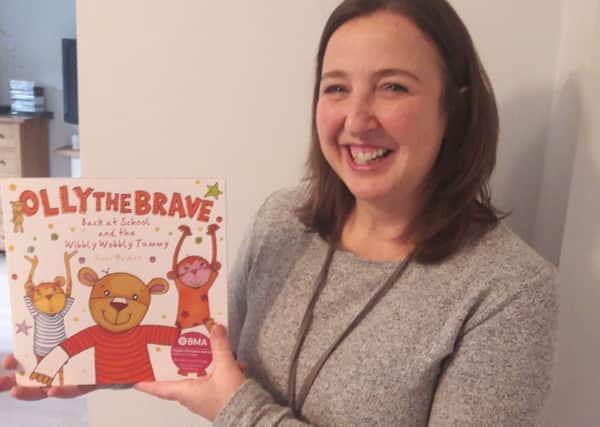 Rachel Ollerenshaw with the third Olly The Brave book.