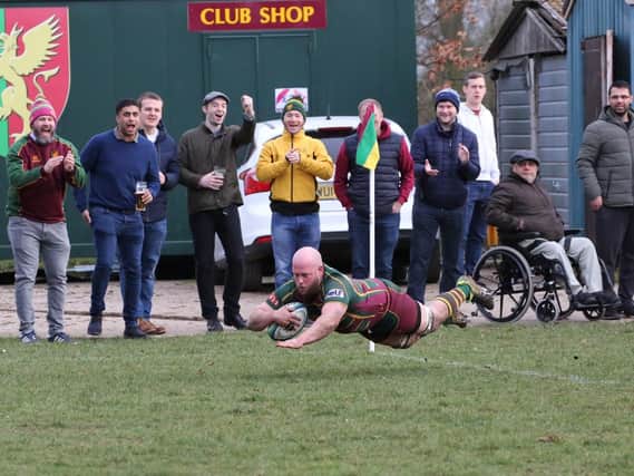 Glenn Todd dives over for his second try of the afternoon