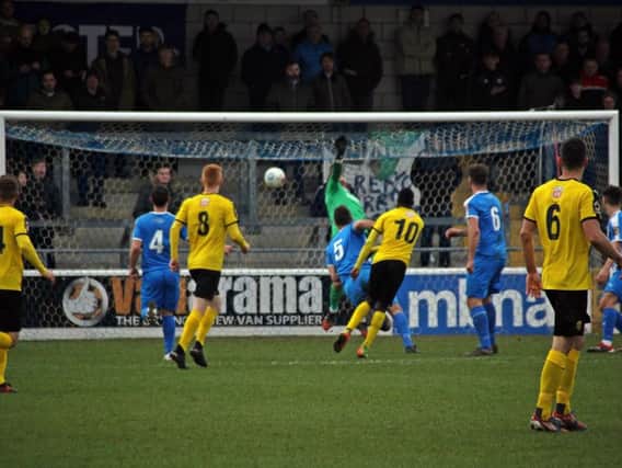 Ahmed Obeng fires home Leamingtons equaliser. Picture by Sally Ellis