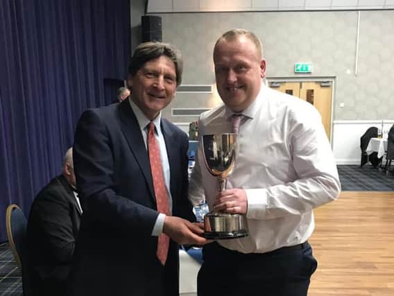 John Barclay (ex Sussex and MCC) presents Willoughby Cricket Club's Karl Quinney with the Halesowen Trophy for services to youth cricket
