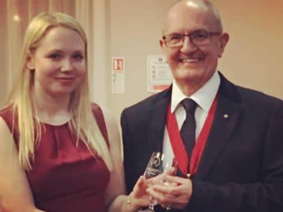 Rally driver Ashleigh Morris receiving one of her trophies at the Association of North Western Car Clubs 2018 awards