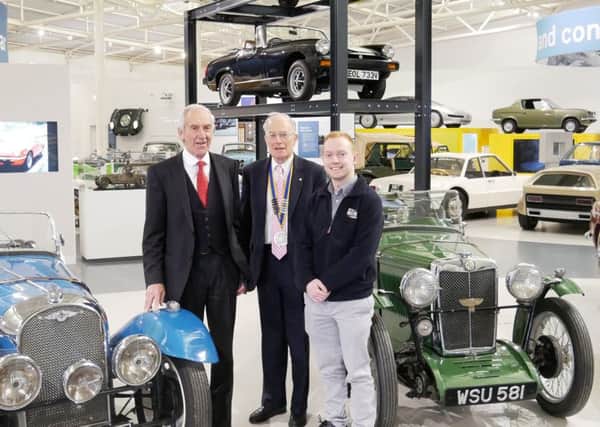Leamington Rotary Club president David Leigh-Hunt (centre) with David Derbyshire from Kia Warwick (left) and Mark Treadwell from the marketing department of the British Motor Museum at Gaydon.
