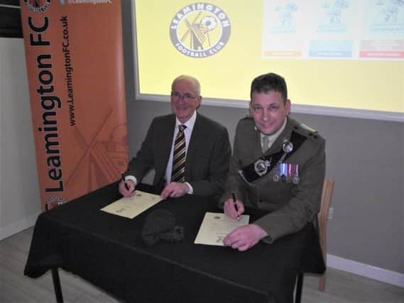 Leamington FC Chairman Jim Scott and Lieutenant Colonel Paul Walkley sign the Armed Forces Covenant.