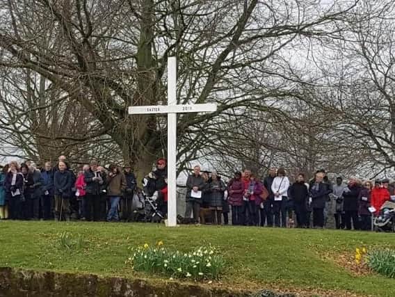 The crowd next to the cross in Abbey Fields in 2018. Photo by Cllr Richard Dickson