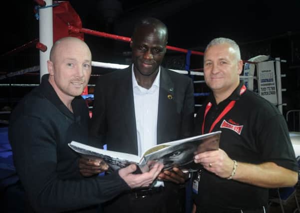 Ady Bush, right, with Franco Wanyama and Edwin Cleary at a Cleary's show in 2012.