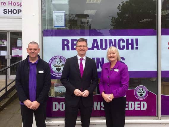 Jeremy Wright MP (centre) at the reopening with shop manager, Neil Johnson, and Shakespeare Hospice Chief Executive Angie Arnold