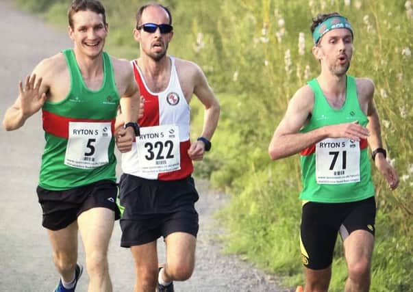 Spa Striders' Ian Allen and Chris Mckeown show contrasting emotions at the Ryton 5.