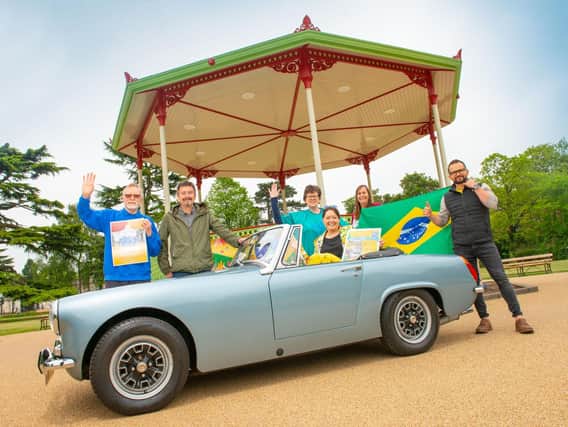 Stephanie Kerr (BID Leamington) is pictured in an Austin Healey Sprite in the Pump Room Gardens with, from left to right, Mike Hoyland (Cars at the Spa), Graham Taylor (owner of the Austin Healey Sprite), Sara Mead (Leamington Peace Festival), Alison Shaw (BID Leamington) and Leandro Menezes (Brazilian Festival).