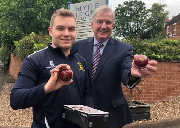 Warwick Cricket Club's Josh Osborne collects his cricketer of the month prize from Blythe Liggins partner Tim Lesters.