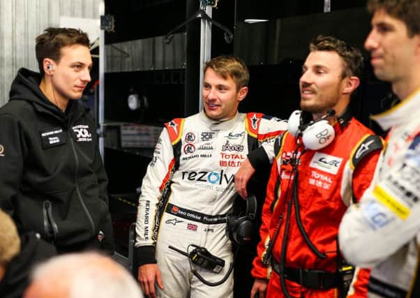 Jordan King, centre, behind the scenes with his Jackie Chan DC Racing x Jota team-mates. Picture: Antonin Vincent / DPPI
