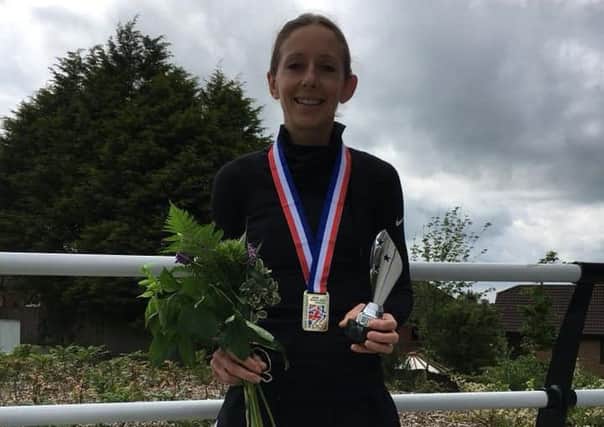 Kelly Edwards shows off her British Masters 5k winnings.