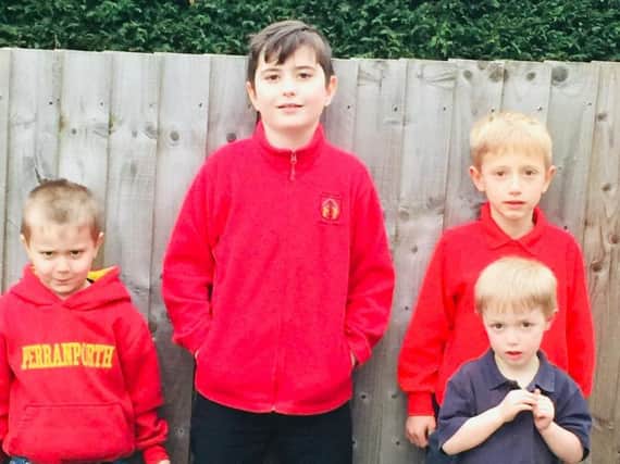 Baginton brothers Mason and Thomas (left and centre) and brothers Ben and James (right) are from families who would be affected by the changes to the free school bus service provision for the village.