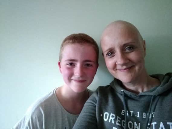 Lorna Bowden with her daughter Chloe, who  shaved her air for Breast Cancer Care. Photo supplied.