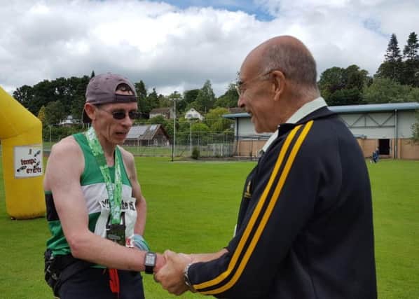 Connor Carson is congratulated on his Offas Dyke 15 win. Picture submitted