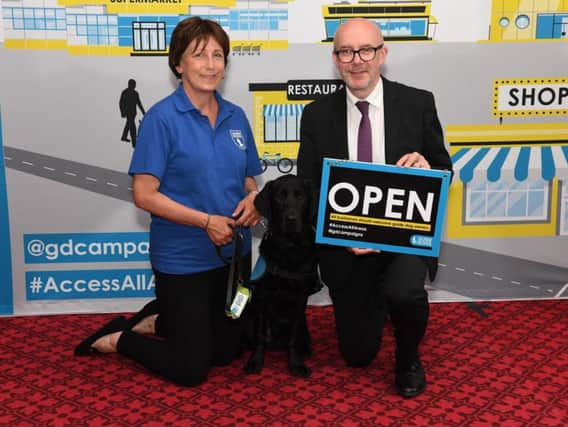 Matt Western MP with Guide Dogs representative Janet and trainee puppy Dave