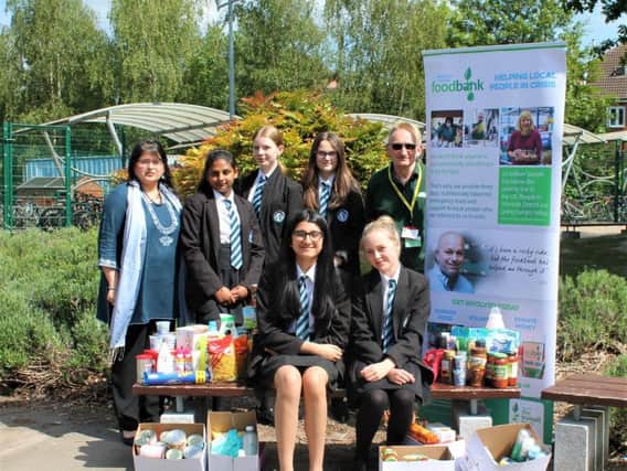 North Leamington School pupils and staff with their some of the food bank donations.