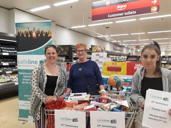 Volunteers collecting for the Safeline tombola in Sainsbury's in Saltisford. Photo supplied.
