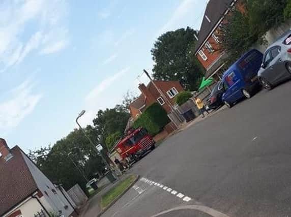 A fire engine is at the scene. Photo by James Cleverley