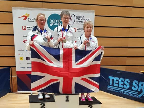 Grace Newman (left) receives her silver medal at the World Transplant Games 2019 in Gateshead.