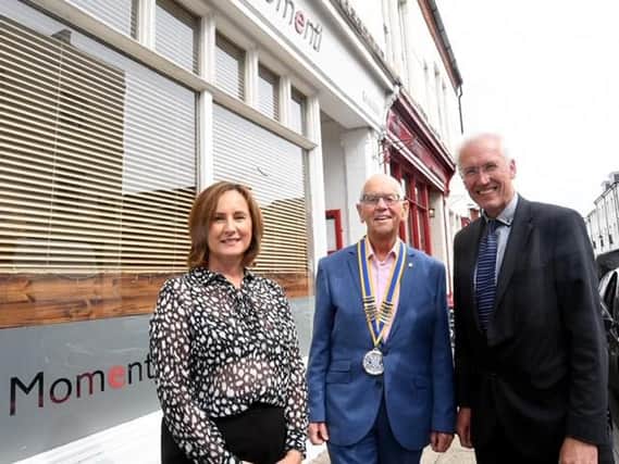 Leamington Rotary Club president Colin Robertson with Alaistair Clark, Managing Director AC Lloyd and Judy Timson, clinical advisor care & community team, Moore & Tibbits solicitors.