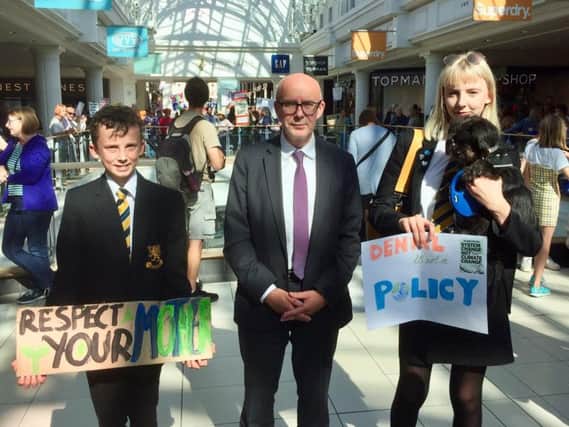 Finn Venn, aged 15, MP Matt Western and Finn's sister, 15-year-old Ella Venn, who attended the climate demonstration at the Royal Priors shopping Centre