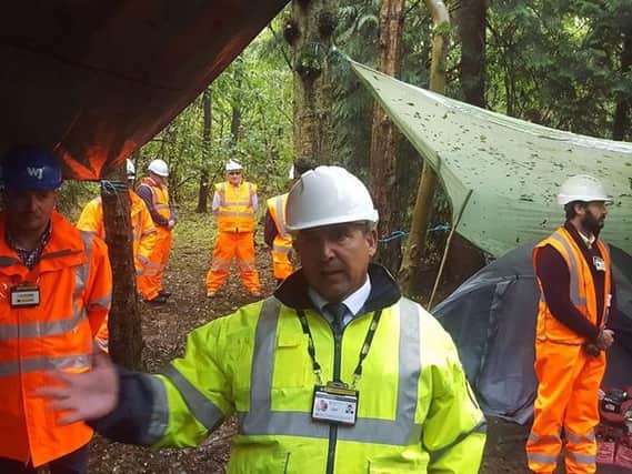 An enforcement officer for HS2 asks the campers at South Cubbington Wood to leave the area.