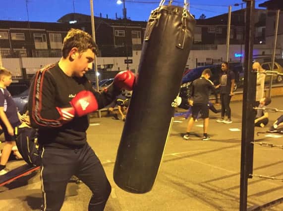 Oscar Selby training in the boxing club at The Kenilworth Centre