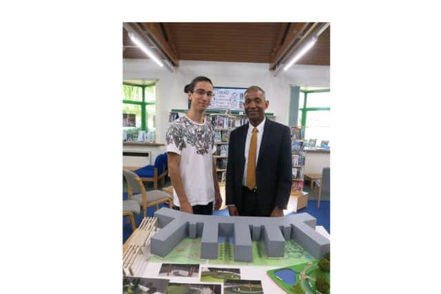 Former Kenilworth School student, architect Attila Csutoras and head teacher Hayden Abbott admire the 3D model Attila created of his vision of the new school site as art of his product design A level.