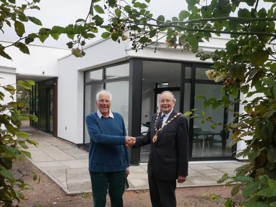 Pictured at the new Hill Close Gardens visitor room Chris Begg with the Chairman of Warwick District Council, Councillor George Illingworth. Photo submitted